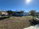 A sprawling backyard leads to an attached staircase for viewing the canal nearby at 12613 4Th Isle, Hudson, FL 34667