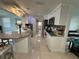 Modern kitchen featuring white cabinets, granite countertops, and stainless steel appliances at 12613 4Th Isle, Hudson, FL 34667