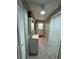 Well-lit laundry room with a sink, cabinetry, and convenient access to the outside at 12613 4Th Isle, Hudson, FL 34667