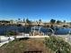 Scenic waterfront view showcasing the neighborhood's canal, docks, and tranquil blue waters at 12613 4Th Isle, Hudson, FL 34667