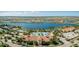 Aerial view of the community clubhouse, pool and lake at 13867 Vadini St, Venice, FL 34293