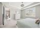Bedroom boasts a large window with shutters, allowing natural light to fill the space at 13867 Vadini St, Venice, FL 34293