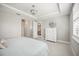 Spacious bedroom featuring neutral tones, recessed lighting, and an ensuite bathroom at 13867 Vadini St, Venice, FL 34293