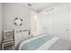 Bedroom featuring a dresser, mirror and an entrance to an ensuite bath at 13867 Vadini St, Venice, FL 34293