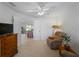 Living room featuring comfortable seating, large windows, and a ceiling fan at 154 Coco Palm Dr, Venice, FL 34292