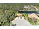 Aerial view of a community pool, showcasing its lush surroundings and proximity to residential homes at 161 Valencia Lakes Dr, Venice, FL 34292