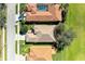 An aerial view of several houses and swimming pools, with neatly kept lawns and landscaped gardens at 161 Valencia Lakes Dr, Venice, FL 34292