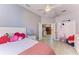 Bright, cozy bedroom offering vinyl flooring, ample natural light, and an open doorway at 161 Valencia Lakes Dr, Venice, FL 34292
