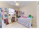 Charming bedroom featuring a well-lit study desk, complemented by a cozy bed and decor at 161 Valencia Lakes Dr, Venice, FL 34292