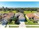 Charming single-story home with tile roof, well-manicured lawn, and attached two-car garage at 161 Valencia Lakes Dr, Venice, FL 34292