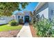 Charming home featuring a landscaped walkway leading to the front door at 161 Valencia Lakes Dr, Venice, FL 34292