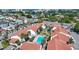 A beautiful aerial view of condos with pool in Madeira Beach, Florida, with red tile roofs at 1636 Stickney Point Rd # 36-201, Sarasota, FL 34231