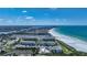 Aerial view of coastal community and beachfront homes on the water at 1636 Stickney Point Rd # 36-201, Sarasota, FL 34231
