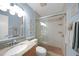 Updated bathroom includes a glass-enclosed shower, modern vanity, and decorative coastal accents at 1636 Stickney Point Rd # 36-201, Sarasota, FL 34231