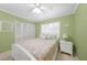 Bright bedroom with a queen bed, white shutters, and a spacious closet for ample storage at 1636 Stickney Point Rd # 36-201, Sarasota, FL 34231