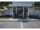 Exterior shot of a two-story condominium with covered entries at 1636 Stickney Point Rd # 36-201, Sarasota, FL 34231