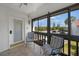 Relaxing lanai features comfortable chairs and views of the well-maintained community and surroundings at 1636 Stickney Point Rd # 36-201, Sarasota, FL 34231