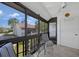Enclosed lanai with comfortable seating, providing a relaxing outdoor space with views of the community at 1636 Stickney Point Rd # 36-201, Sarasota, FL 34231