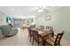 Open-concept living and dining area with tile flooring, ceiling fans, and plenty of natural light at 1636 Stickney Point Rd # 36-201, Sarasota, FL 34231