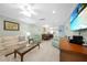 Inviting living room boasts tile flooring, comfortable seating, and seamless flow to the dining area at 1636 Stickney Point Rd # 36-201, Sarasota, FL 34231