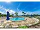 Community outdoor pool and lounge area with lake views at 1636 Stickney Point Rd # 36-201, Sarasota, FL 34231
