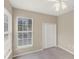 Bedroom featuring carpet floors, a double-door closet, and natural light at 1697 San Silvestro Dr, Venice, FL 34285