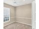 Neutral bedroom with a ceiling fan, window with blinds, and carpeted floor at 1697 San Silvestro Dr, Venice, FL 34285
