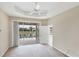 Bedroom featuring a ceiling fan, neutral paint, and views of the community lake at 1697 San Silvestro Dr, Venice, FL 34285
