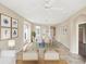 Open-concept living and dining area with coastal decor and plenty of seating for guests at 1697 San Silvestro Dr, Venice, FL 34285