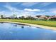 Residential exteriors line a golf course and waterway in a community setting at 1697 San Silvestro Dr, Venice, FL 34285