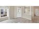 Bright living room featuring shuttered windows and neutral paint at 1697 San Silvestro Dr, Venice, FL 34285