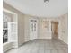 Inviting living area featuring tile floors and shuttered windows at 1697 San Silvestro Dr, Venice, FL 34285