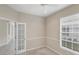 Comfortable office with a window and carpet floors at 1697 San Silvestro Dr, Venice, FL 34285