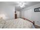 Bright bedroom with a ceiling fan, closet space, and wood-look flooring at 1703 Bal Harbour Dr # 2, Venice, FL 34293
