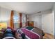 Comfortable bedroom with bright windows, a wooden dresser, and a view of the neighborhood at 1703 Bal Harbour Dr # 2, Venice, FL 34293