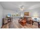 Cozy living room featuring a fireplace, comfortable seating, and hardwood floors at 1703 Bal Harbour Dr # 2, Venice, FL 34293