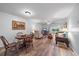 Open living room featuring wood-look flooring, neutral paint, and ample seating at 1703 Bal Harbour Dr # 2, Venice, FL 34293