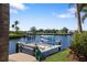 View of a boat lift situated on the canal; great for keeping the boat clean and ready to go at 19227 Palmdale Ct, Port Charlotte, FL 33948