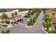 Scenic aerial view of a street lined with palm trees and buildings in Venice, Florida, showcasing city charm at 19340 Bluff Dr, Venice, FL 34292