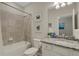 Bathroom with a tub, tiled shower, and a vanity with a granite counter at 19340 Bluff Dr, Venice, FL 34292