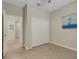 Light and bright bedroom with a closet and doorway leading to another room at 19340 Bluff Dr, Venice, FL 34292