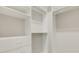 Well-organized walk-in closet with custom shelves, drawers, and hanging rods at 19340 Bluff Dr, Venice, FL 34292