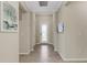 Inviting hallway with decorative lighting and tile floors leads to the main living areas at 19340 Bluff Dr, Venice, FL 34292