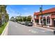 Picturesque street view with colorful buildings, palm trees, and parked cars in Venice, Florida at 19340 Bluff Dr, Venice, FL 34292