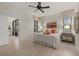 Airy main bedroom with plank floors, a ceiling fan, and sliding glass doors to outdoor patio at 20235 Pezzana Dr, Venice, FL 34292