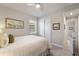 Bright bedroom with closet, window and neutral color palette for a relaxing atmosphere at 20740 Ovid Ln, Venice, FL 34293