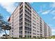 The exterior of the building with red roof offers a clean and modern look at 232 Saint Augustine Ave # 207, Venice, FL 34285