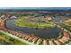 Gorgeous aerial view of Sarasota National community showcasing golf course, lakes and single-Gathering homes at 23415 Waverly Cir, Venice, FL 34293