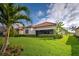 Charming home with a well-manicured lawn and a screened-in patio for relaxing outdoors at 23415 Waverly Cir, Venice, FL 34293