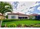 Charming home with a well-manicured lawn and a screened-in patio for relaxing outdoors at 23415 Waverly Cir, Venice, FL 34293